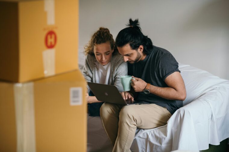 2 person using laptop