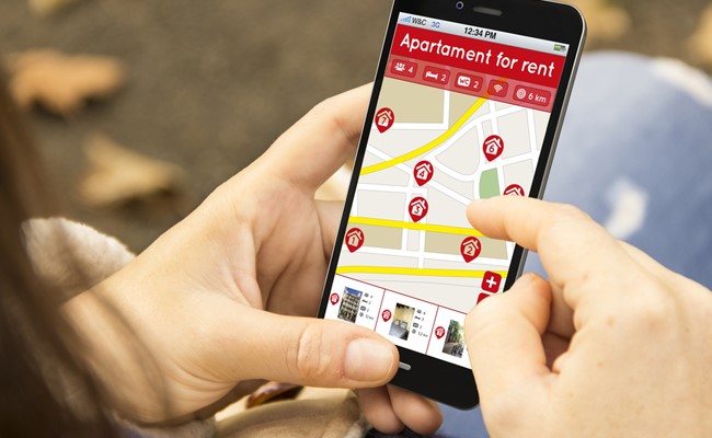 person locating katy texas apartments for rent on smart phone