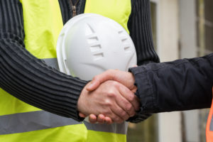 Successful handshake deal on construction site